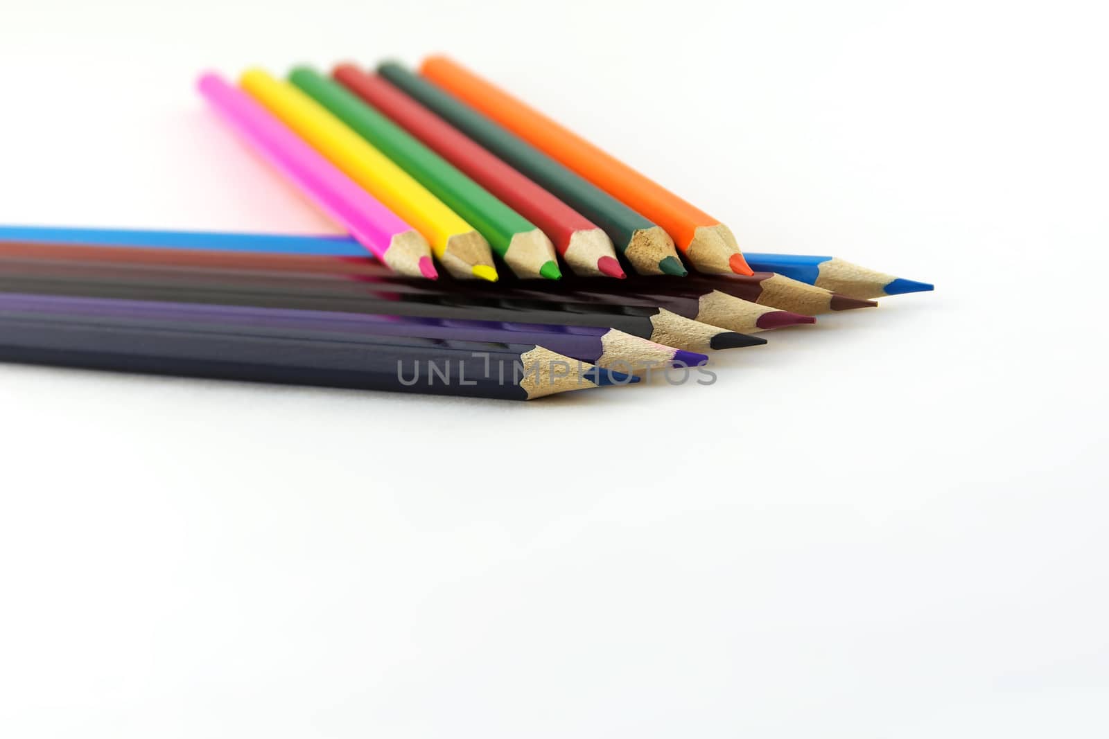 On the bright surface is a set of color pencils for drawing
