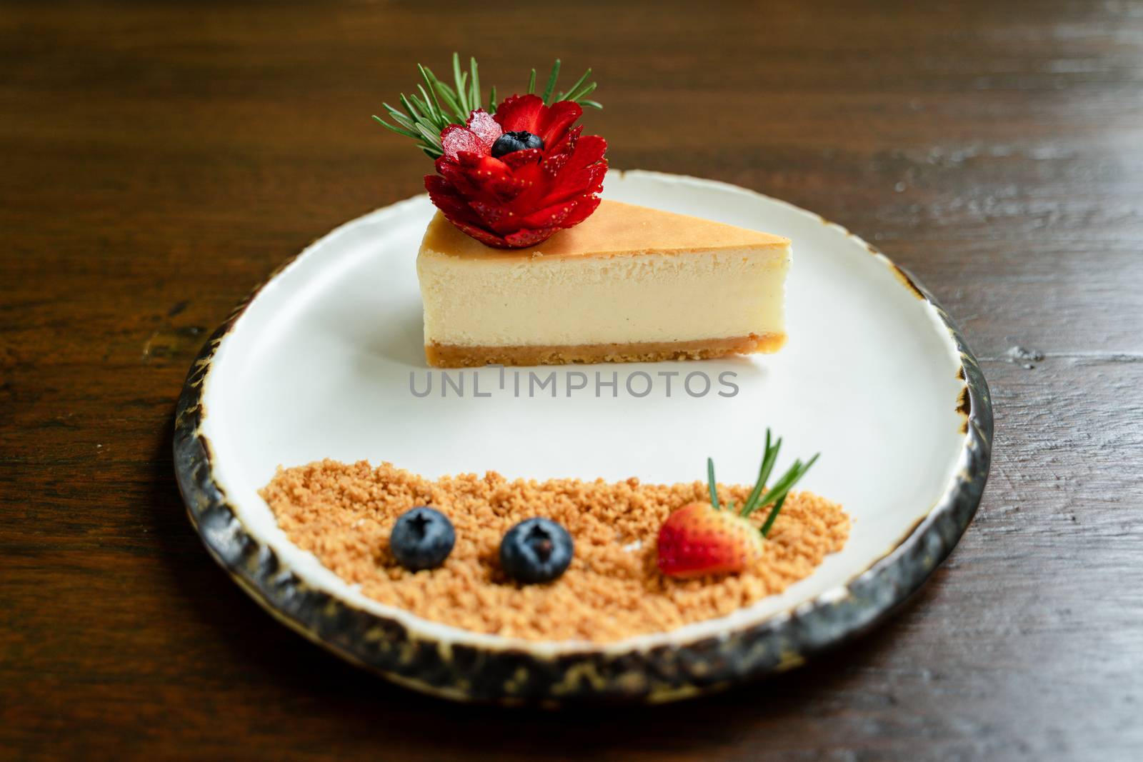 Top view photos of beautifully decorated cakes on white tiled plates and background of old wooden tables