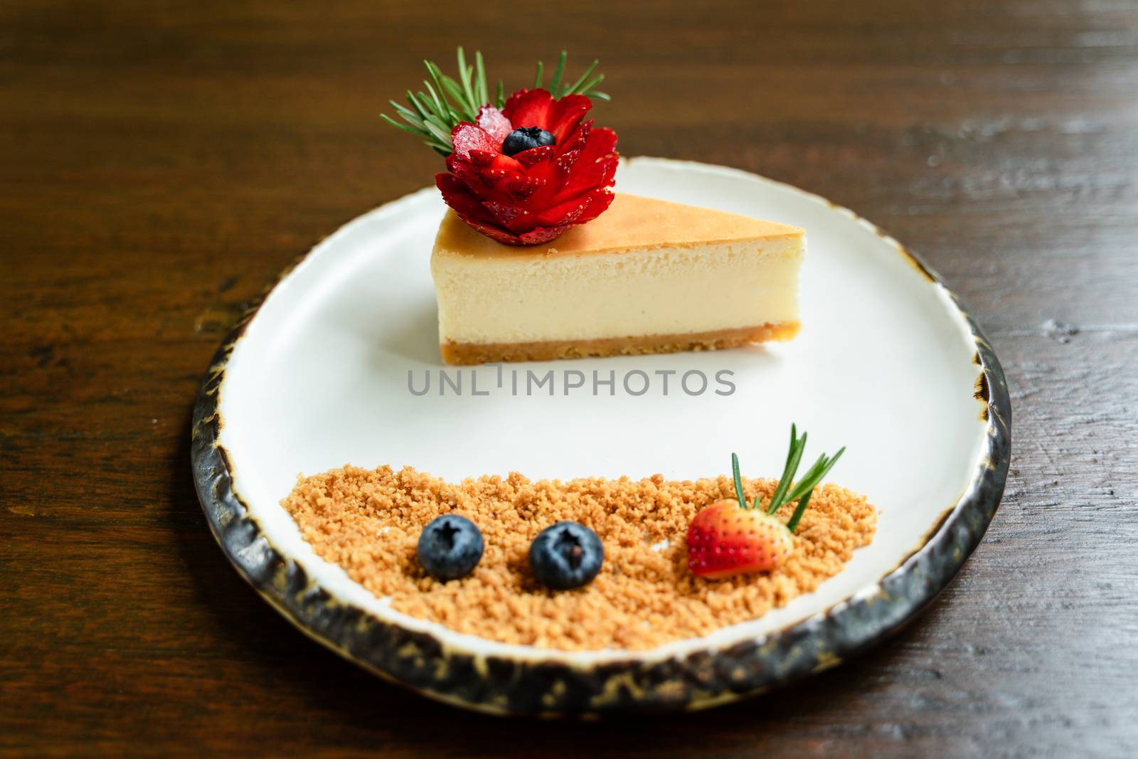 Top view photos of beautifully decorated cakes on white tiled plates and background of old wooden tables