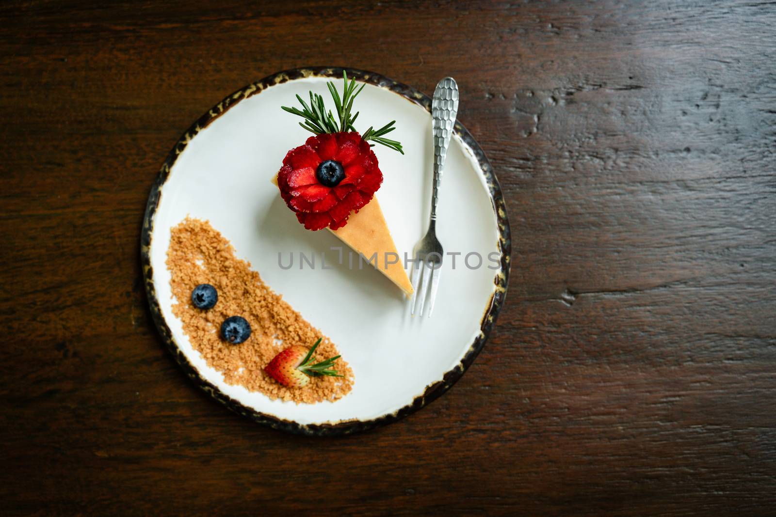 Top view photos of beautifully decorated cakes on white tiled plates and background of old wooden tables