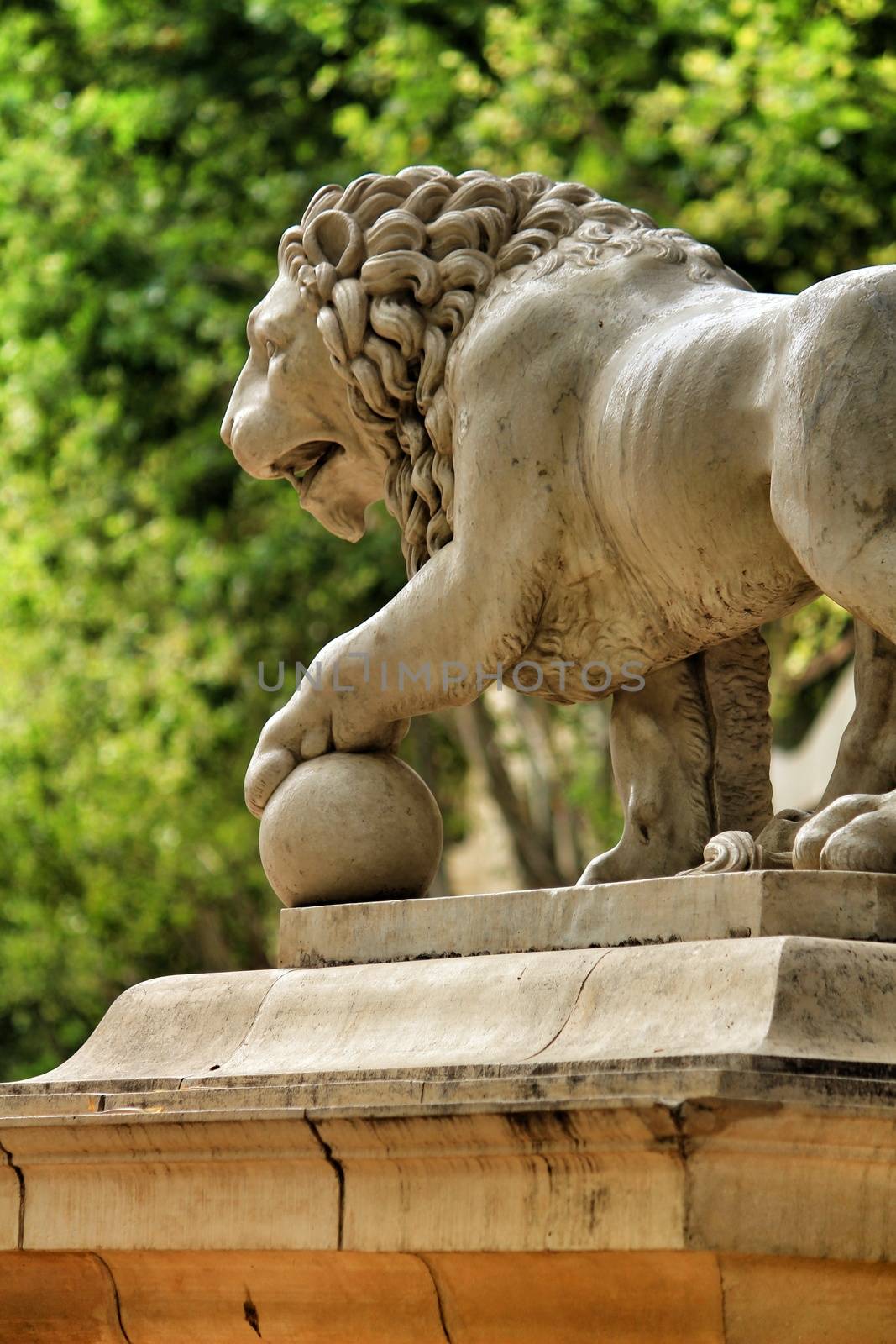 Lion sculpture at the end of Explanada promenade in Alicante, Spain