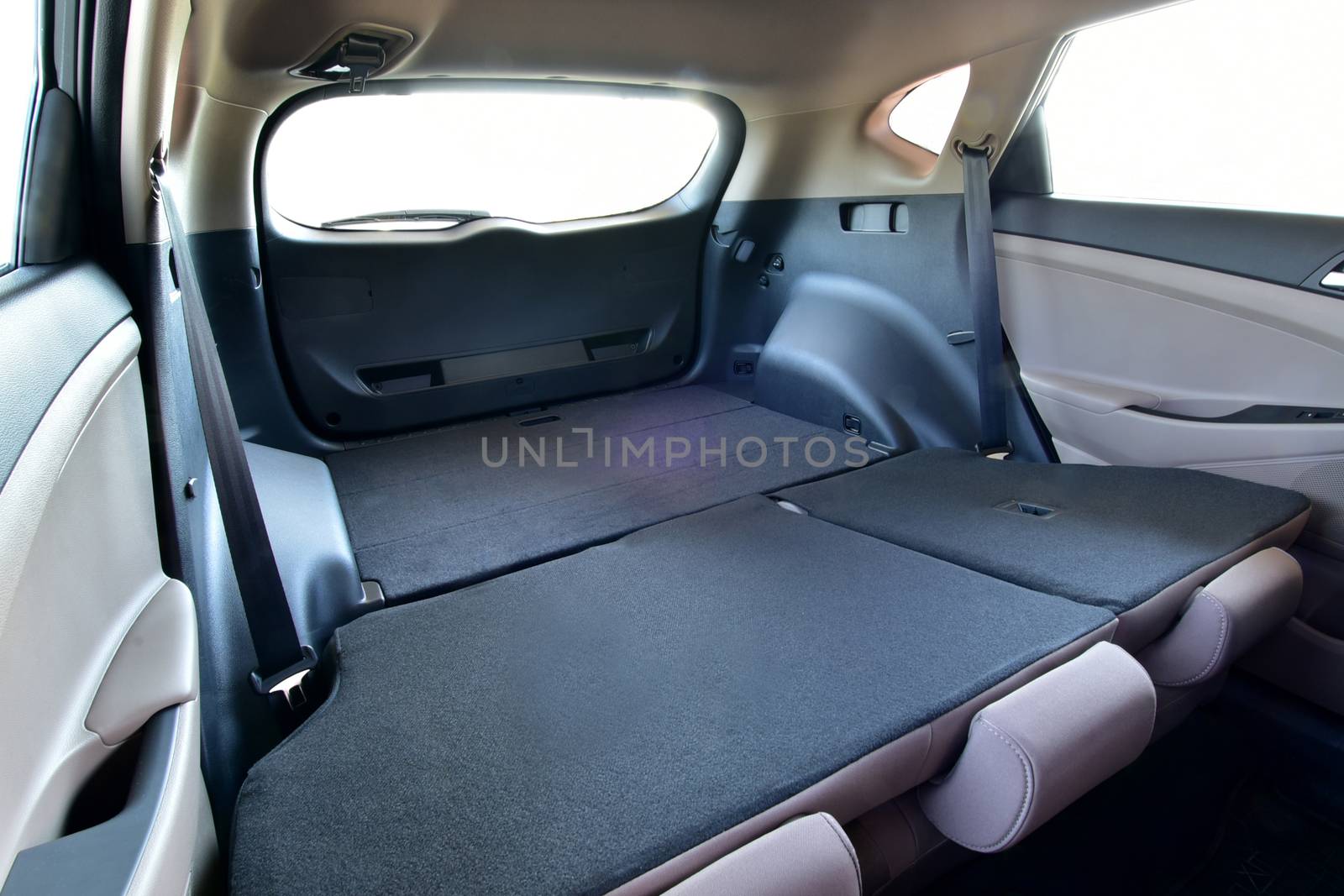 Trunk of car with rear seats folded, inside view