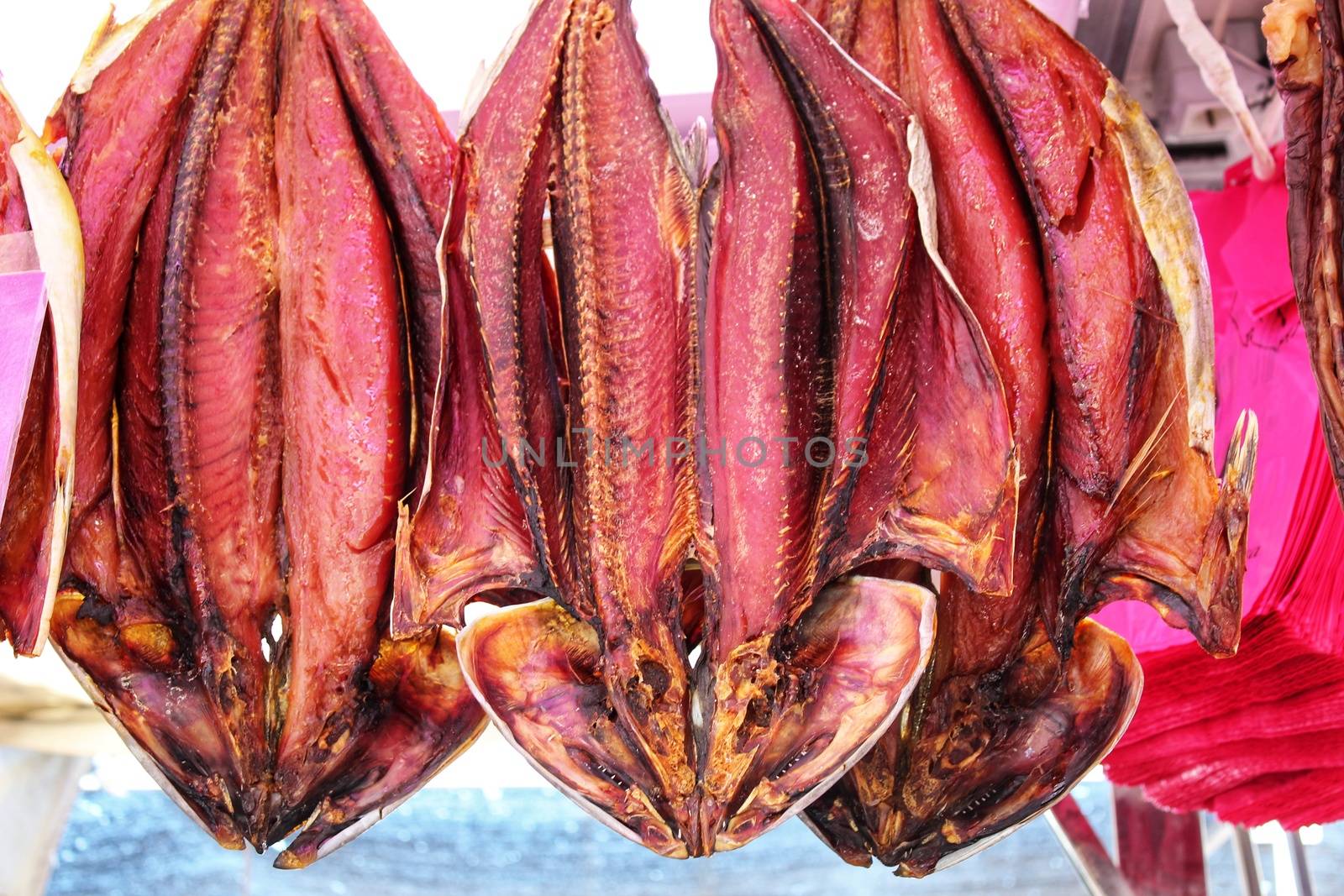 Salted fish products for sale at a market stall  by soniabonet