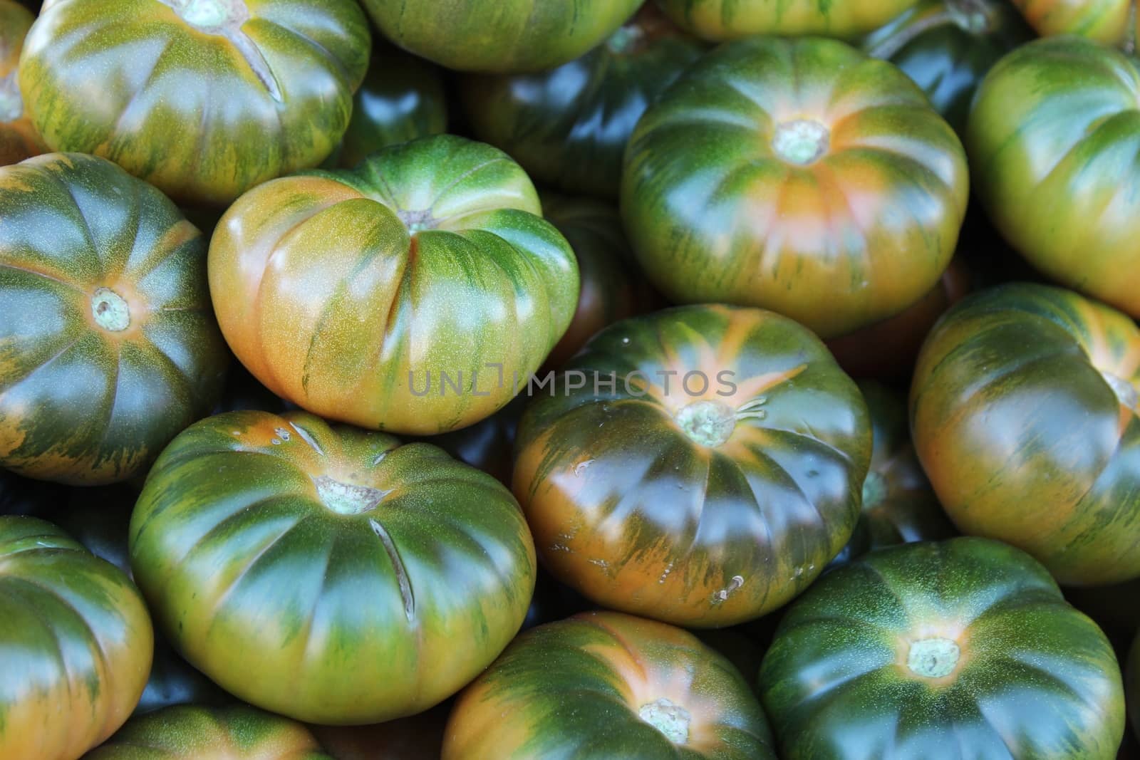 Tomatoes for sale at a market stall by soniabonet