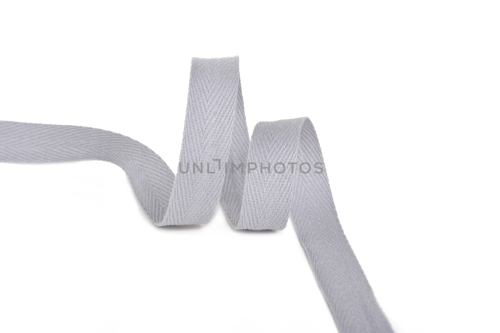 gray Twisted ribbon of cotton Keeper braid on white background. Tape For sewing clothes.