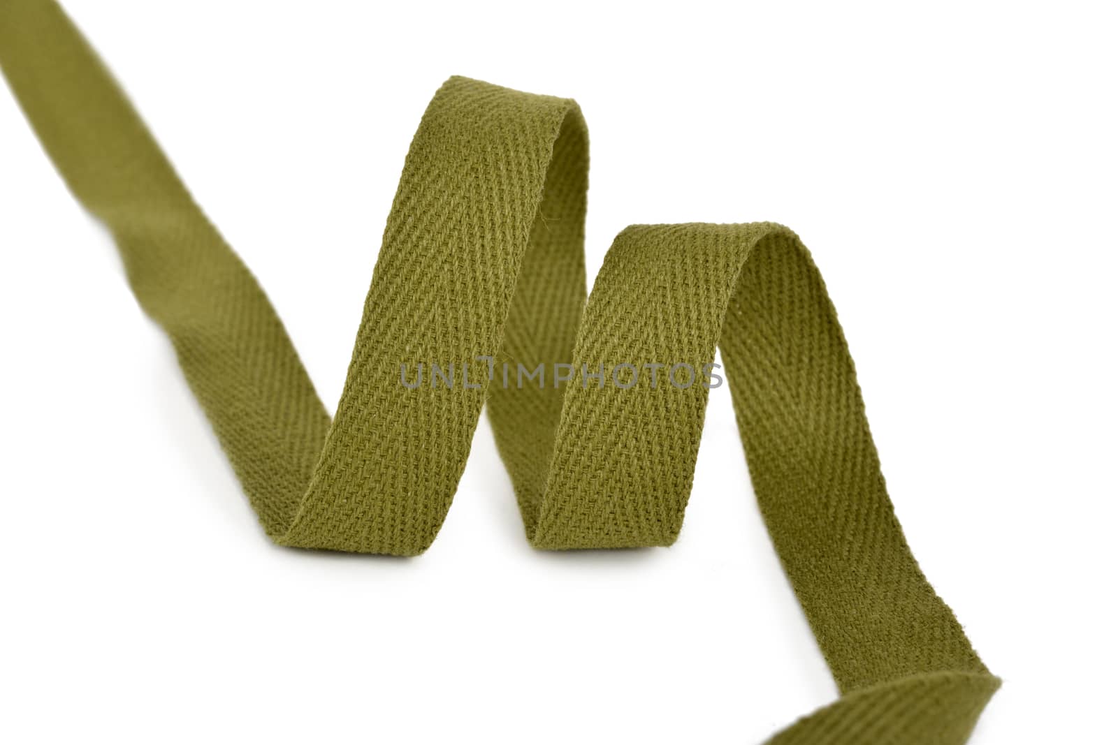 khaki Twisted ribbon of cotton Keeper braid on white background. Tape For sewing clothes.