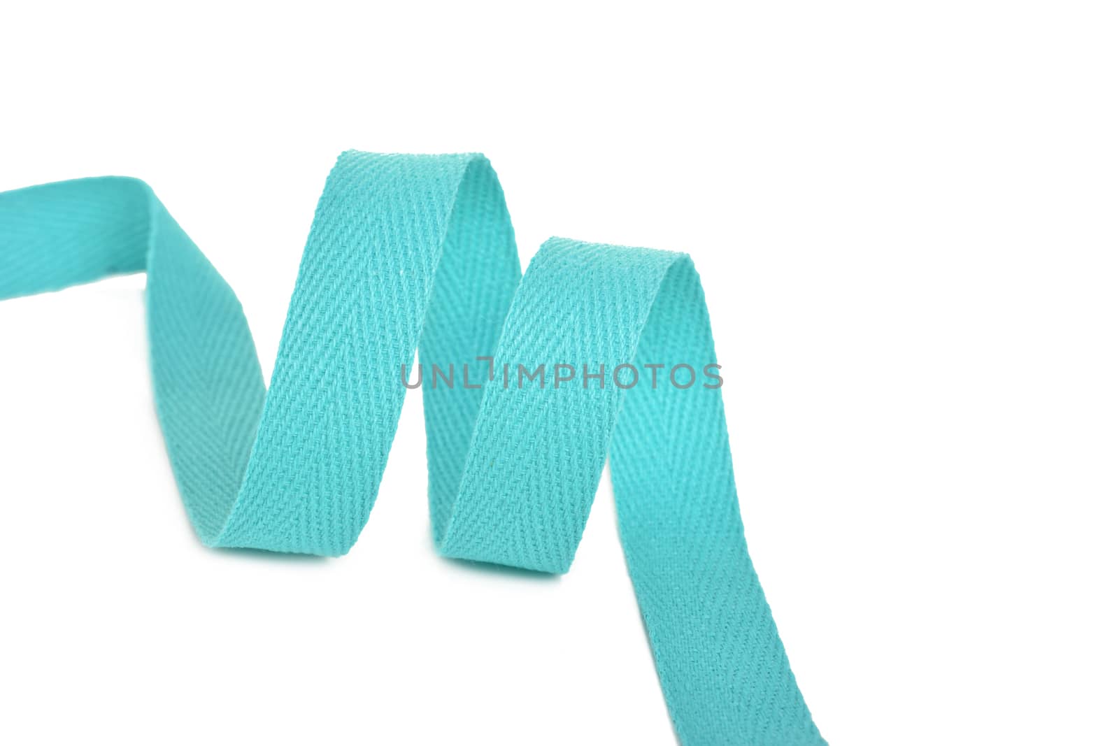 emerald Twisted ribbon of cotton Keeper braid on white background. Tape For sewing clothes.