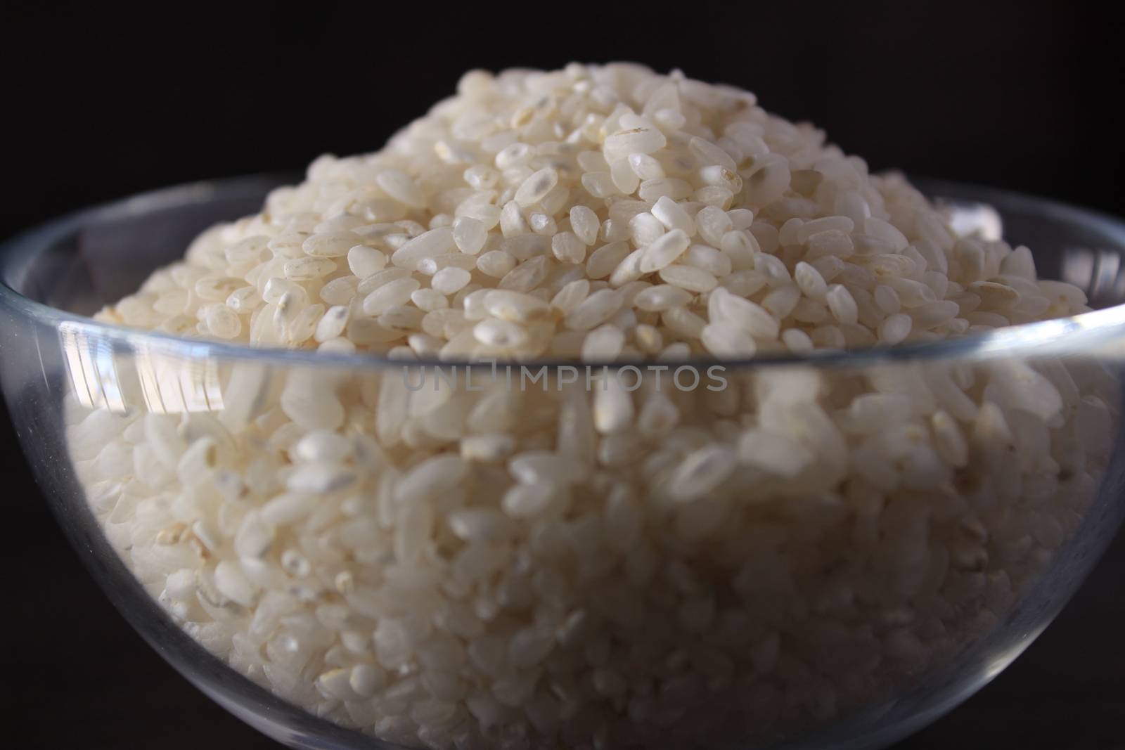 White rice texture and background in glass bowl by soniabonet