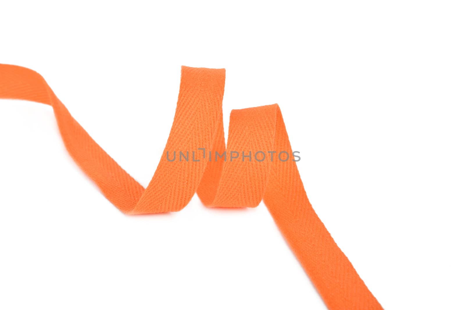 orange Twisted ribbon of cotton Keeper braid on white background. Tape For sewing clothes.