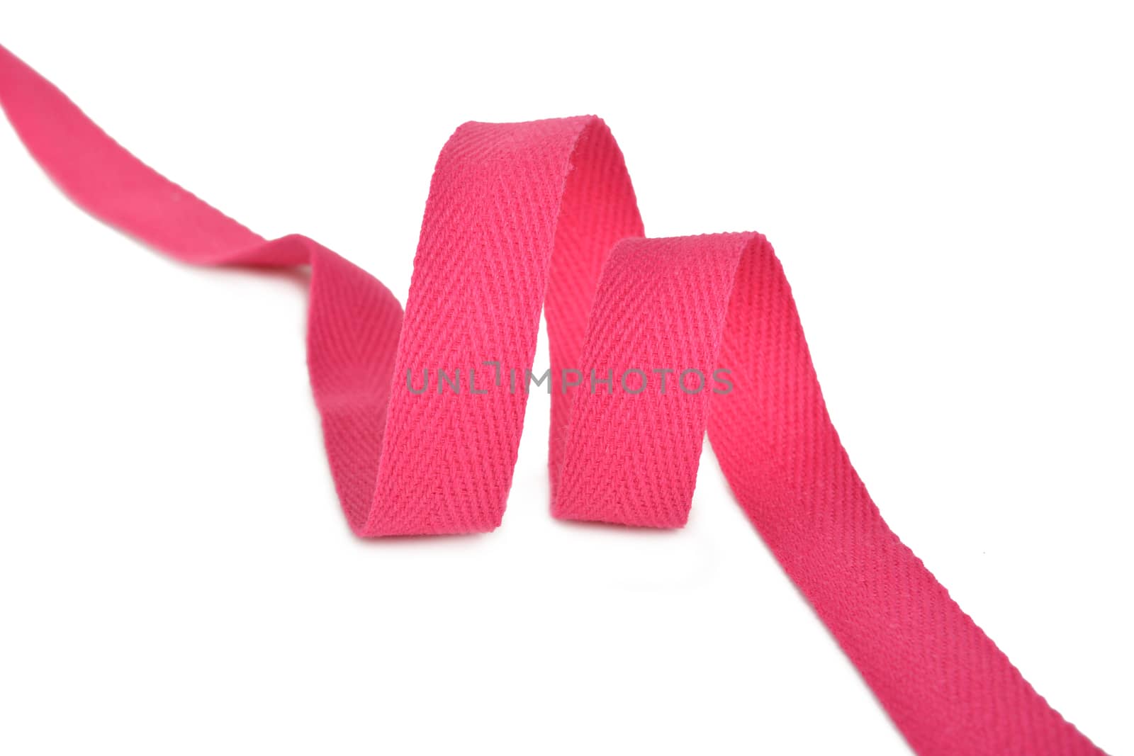 pink Twisted ribbon of cotton Keeper braid on white background. Tape For sewing clothes.