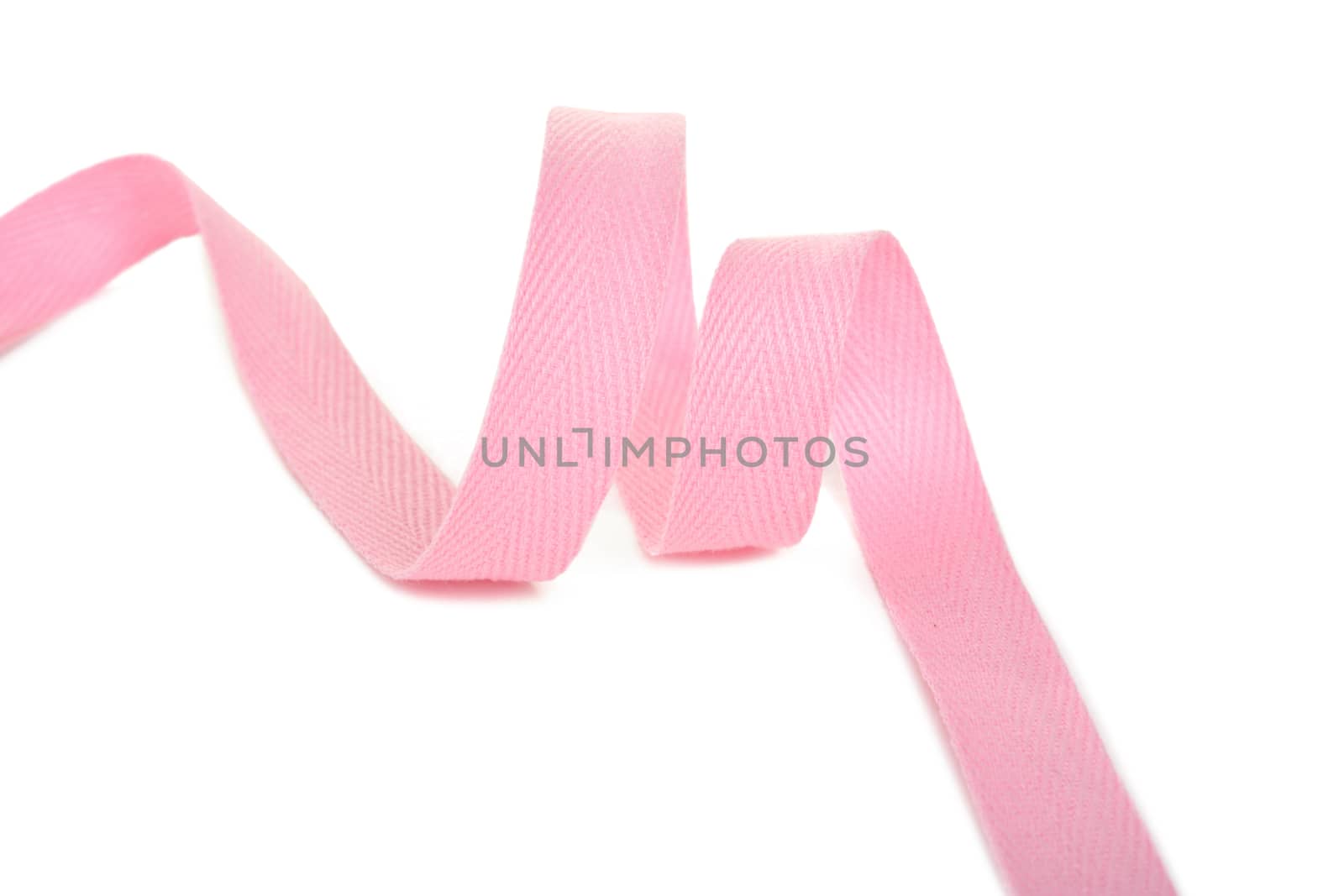 pink Twisted ribbon of cotton Keeper braid on white background. Tape For sewing clothes.