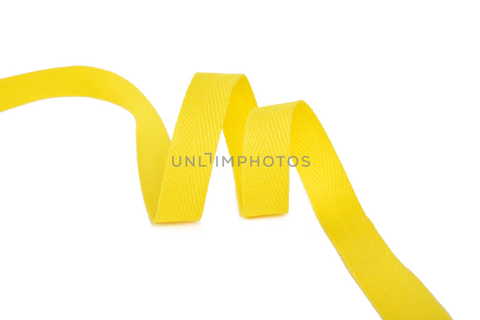 yellow Twisted ribbon of cotton Keeper braid on white background. Tape For sewing clothes.