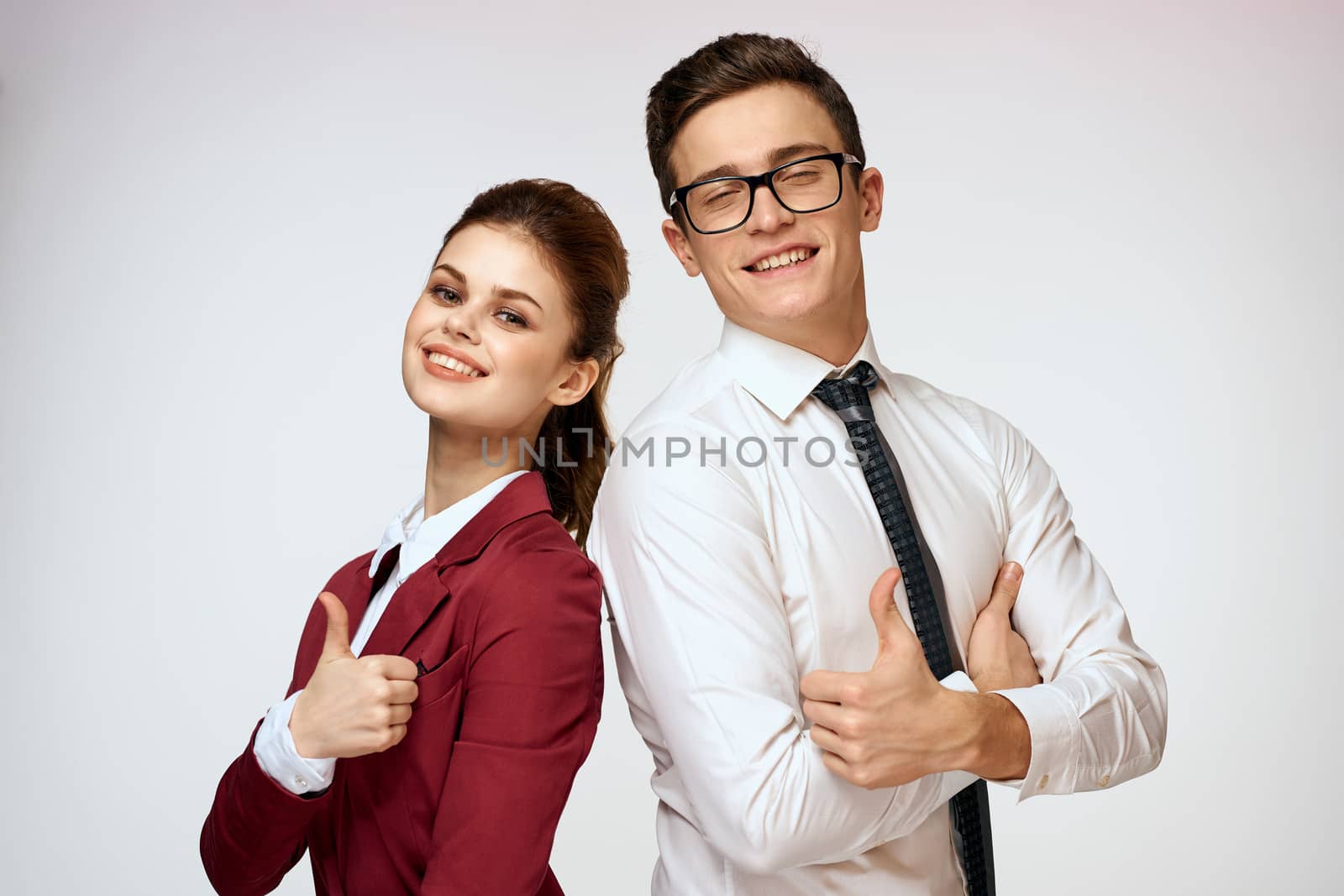Work colleagues Business couple office officials team studio light background. High quality photo