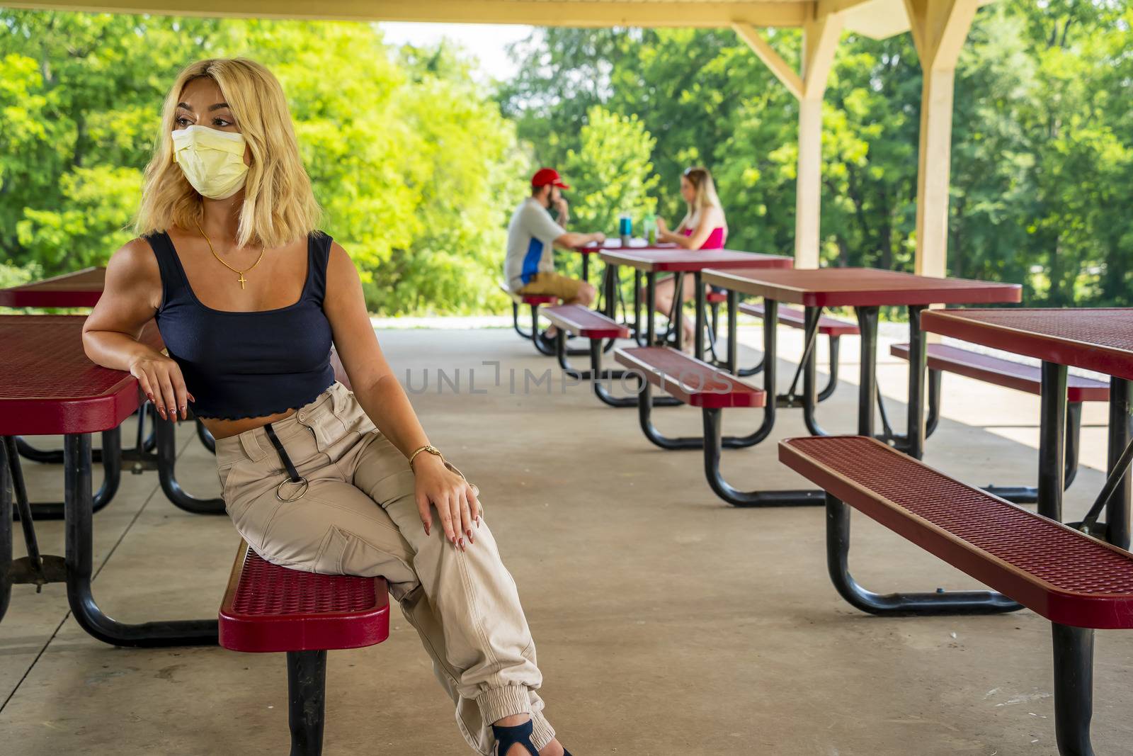 A gorgeous young blonde model enjoys a day outdoors while maintaining a safe distance from others during the Covid-19 pandemic