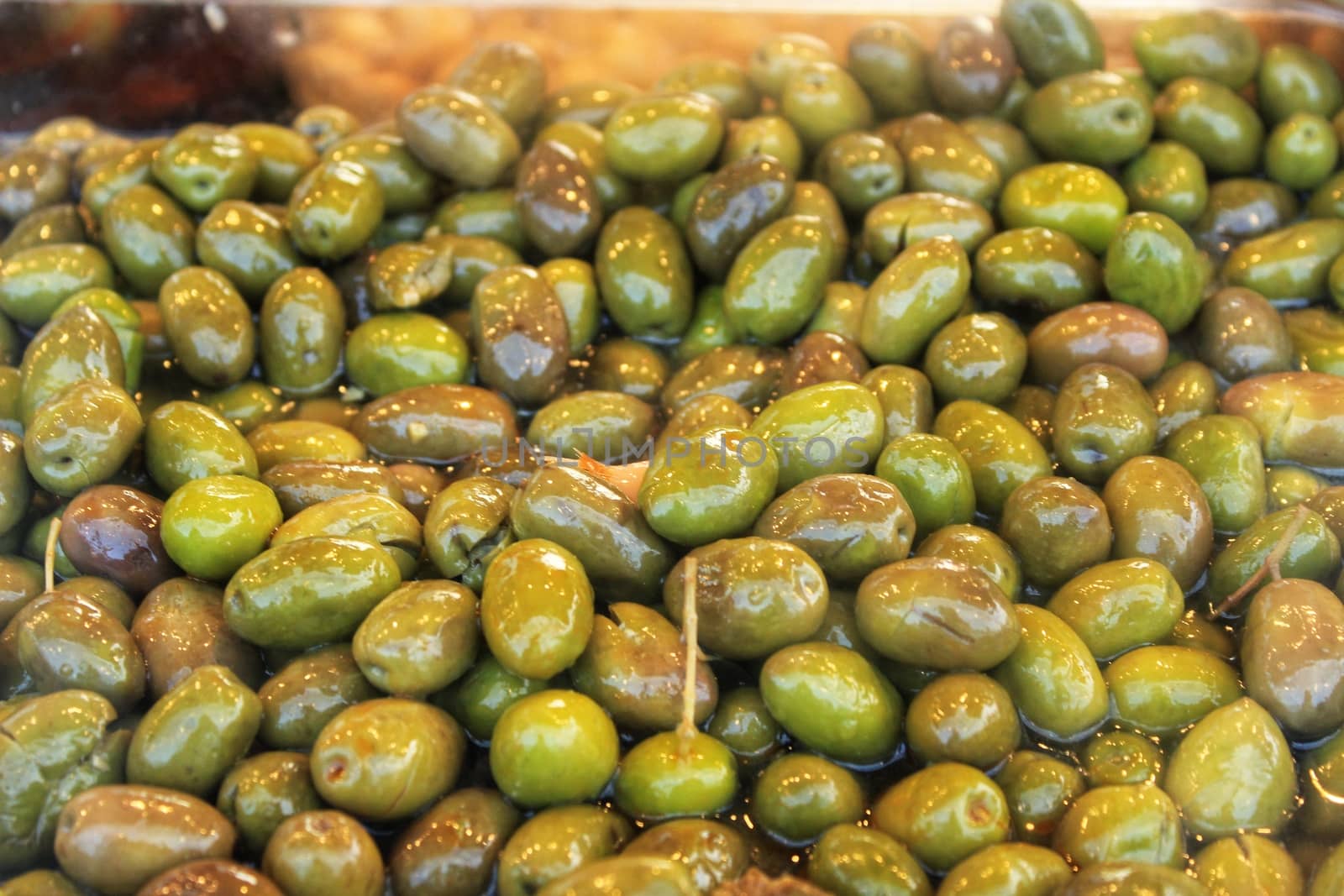 Olives texture at a market stall by soniabonet