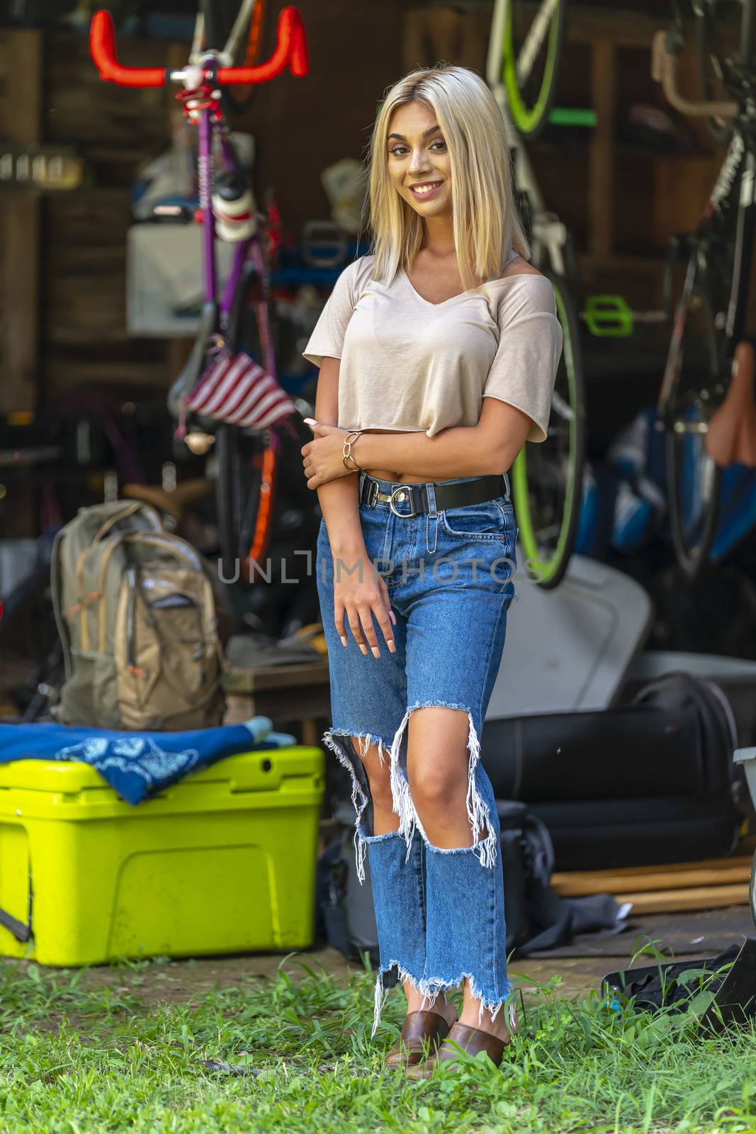 A Young Lovely Blonde Model Poses Outdoors While Enjoying A Summers Day by actionsports