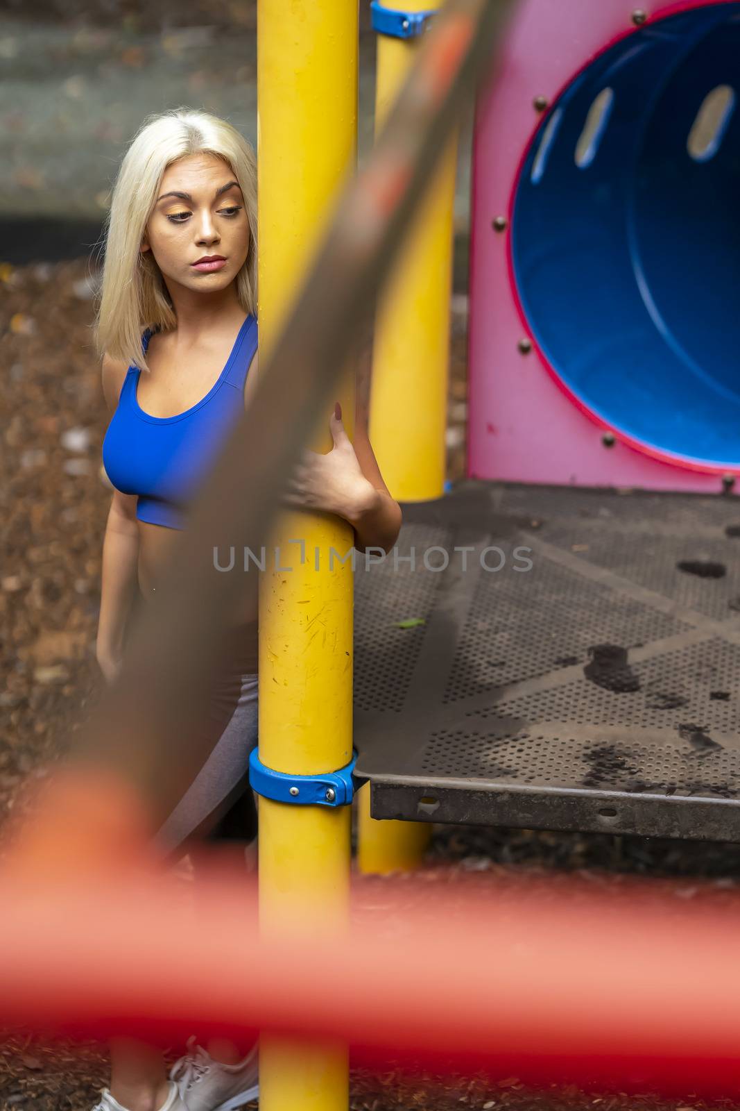 A Young Lovely Blonde Model Works Out Outdoors While Enjoying A Summers Day by actionsports