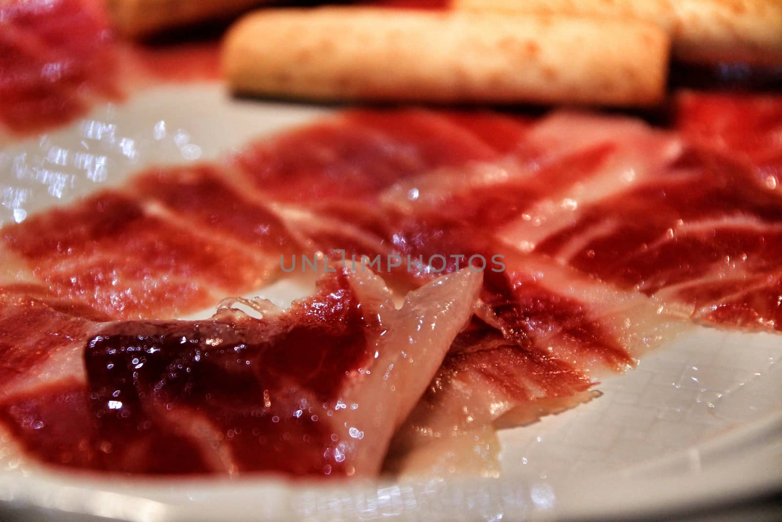 Tasty Iberian ham dish in a bar by soniabonet