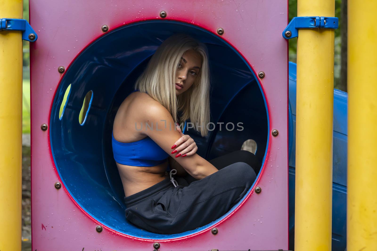 A Young Lovely Blonde Model Works Out Outdoors While Enjoying A Summers Day by actionsports