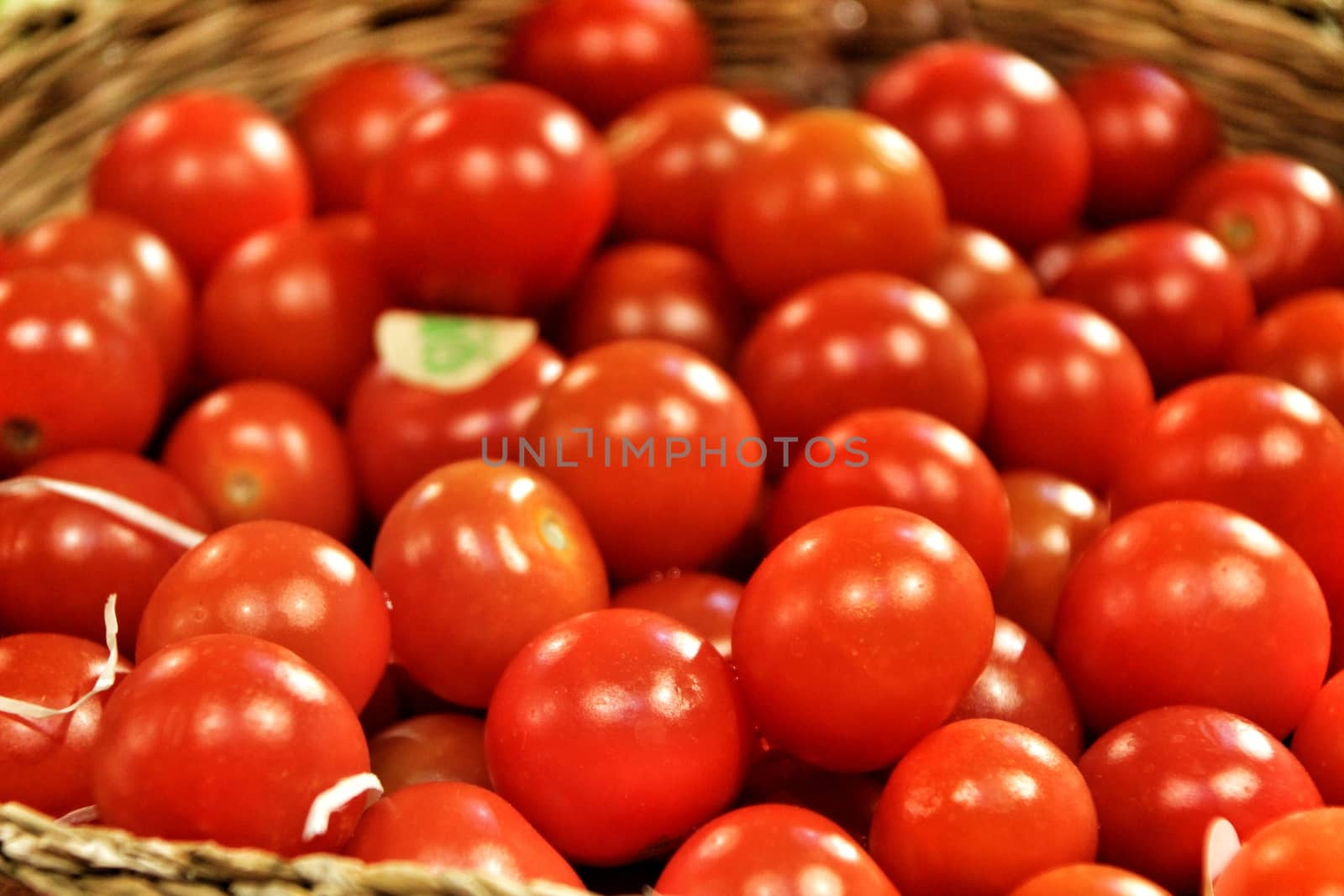 Tomatoes for sale at a farmer market stall in Spain
