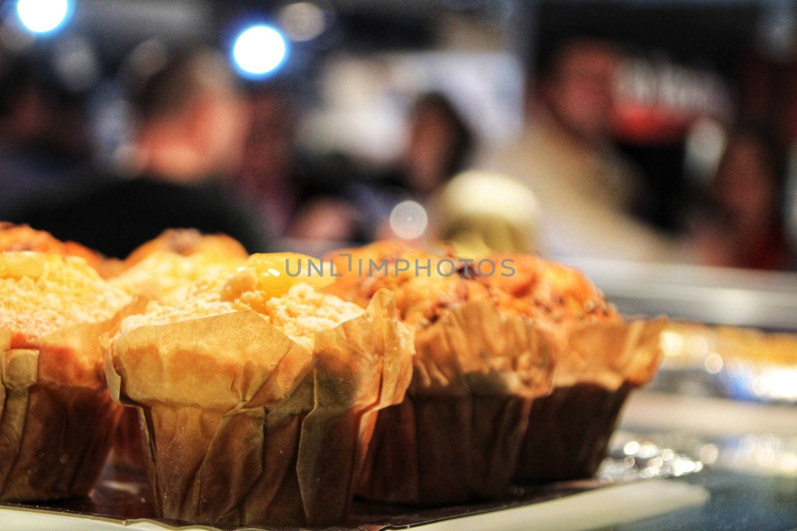 Tasty muffins in a pastry shop by soniabonet