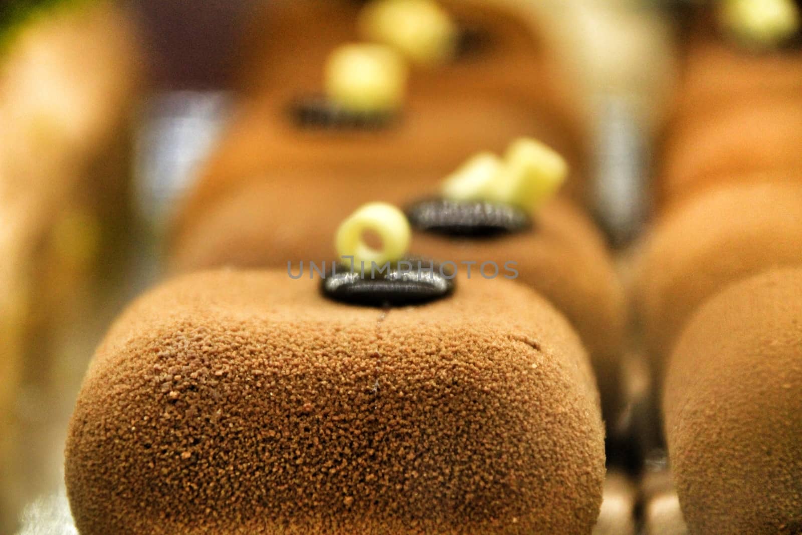 Delicatessen squared Chocolate cakes in a pastry shop by soniabonet