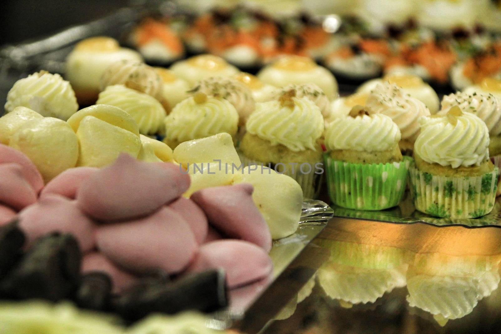 Tray of cakes and sweets in a pastry shop by soniabonet