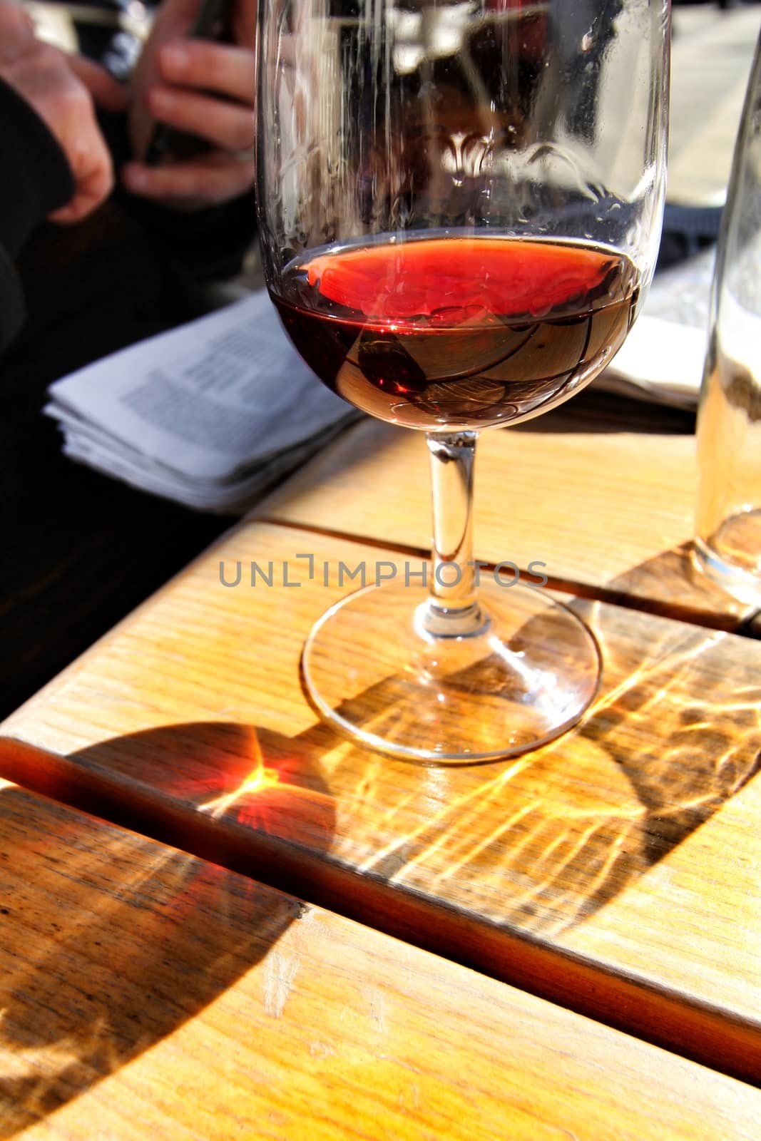 Glass of port wine tawny on a table by soniabonet