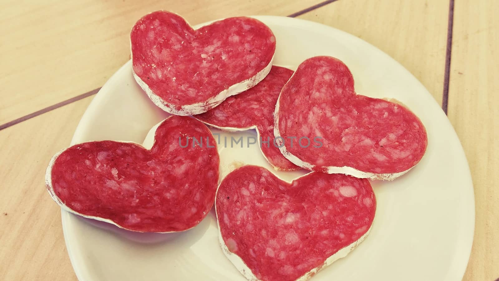 Slices of heart-shaped spanish sausage on a plate