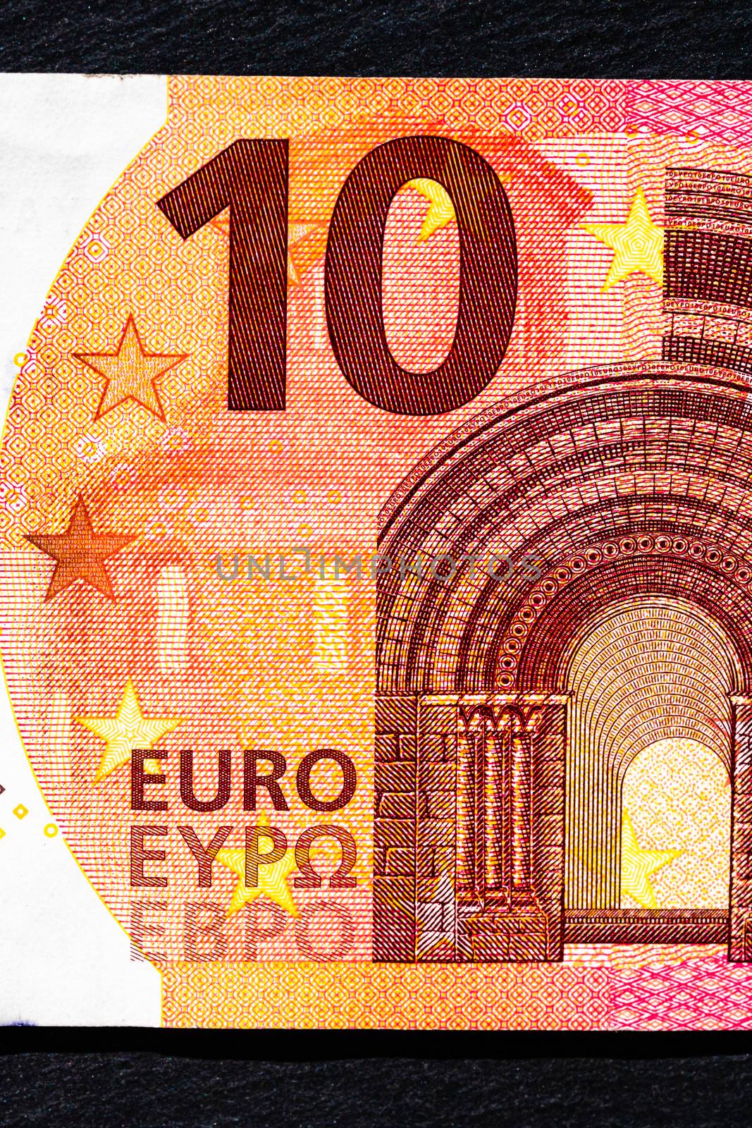 Selective focus on detail of euro banknotes. Close up macro detail of money banknotes, 10 euro isolated. World money concept, inflation and economy concept
