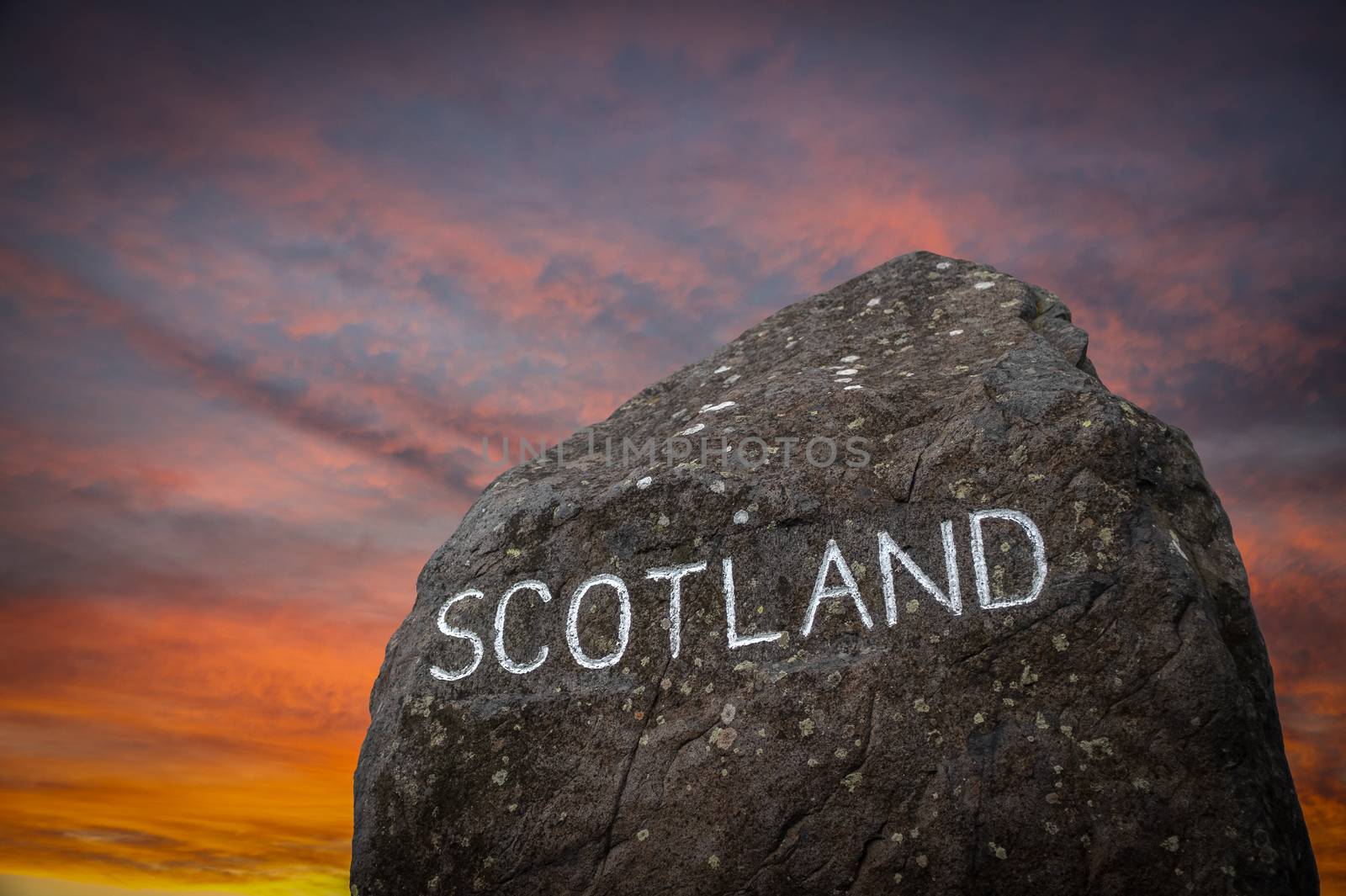 A Stone Marking The Border Between England And Scotland During A Beautiful Sunset