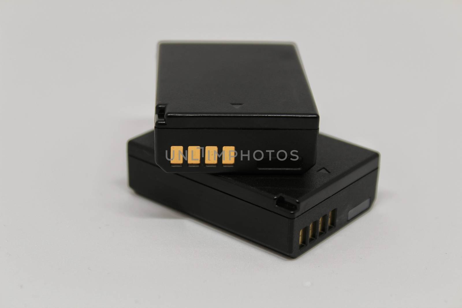 Digital camera batteries on white background