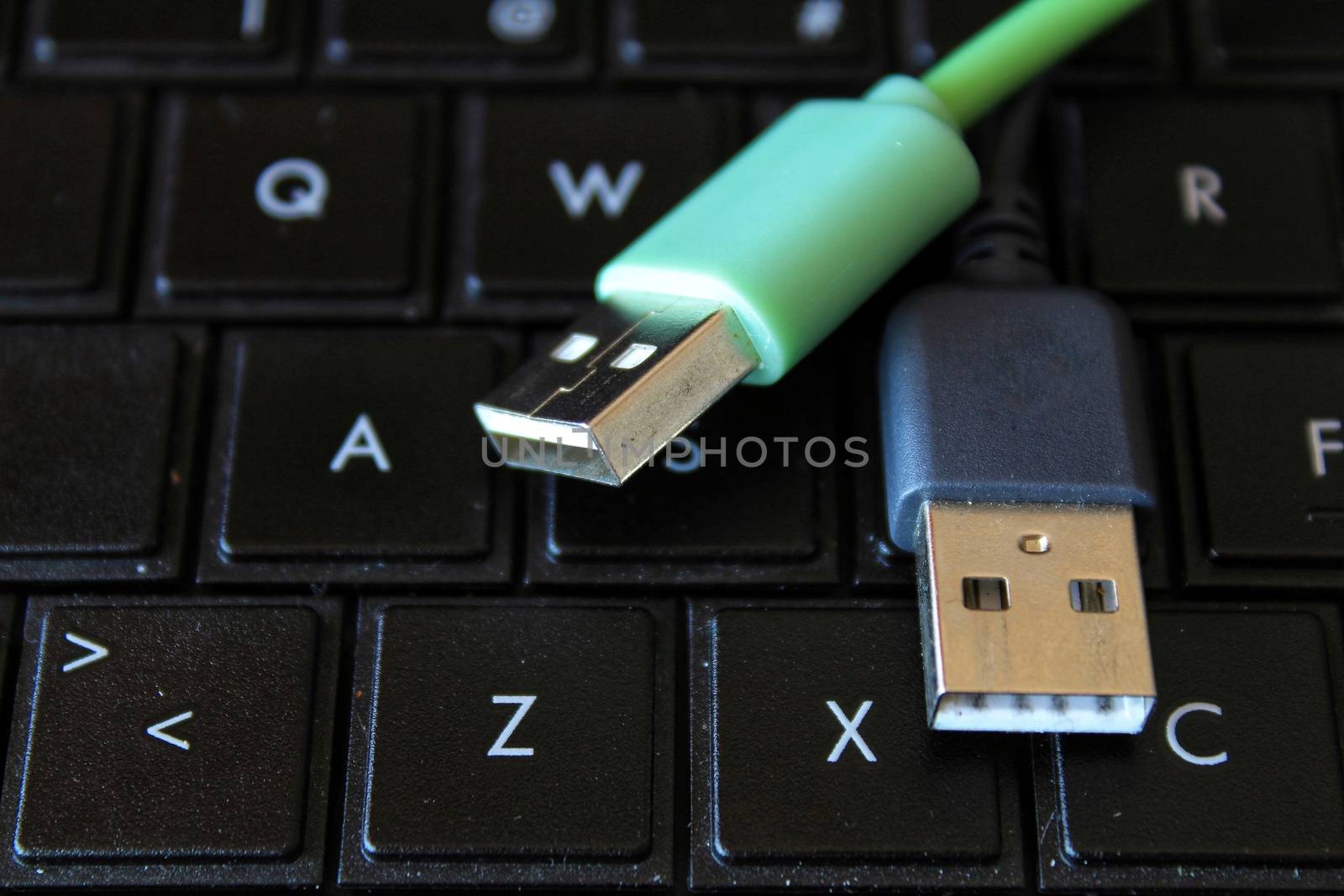 USB connectors on black keyboard laptop by soniabonet
