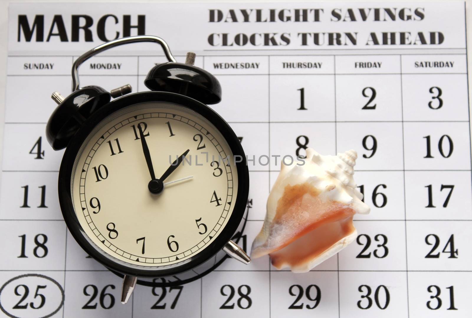 Daylight Savings Spring Forward sunday at 2:00 a.m. March 25 date indicated in the calendar. Clock next to a conch