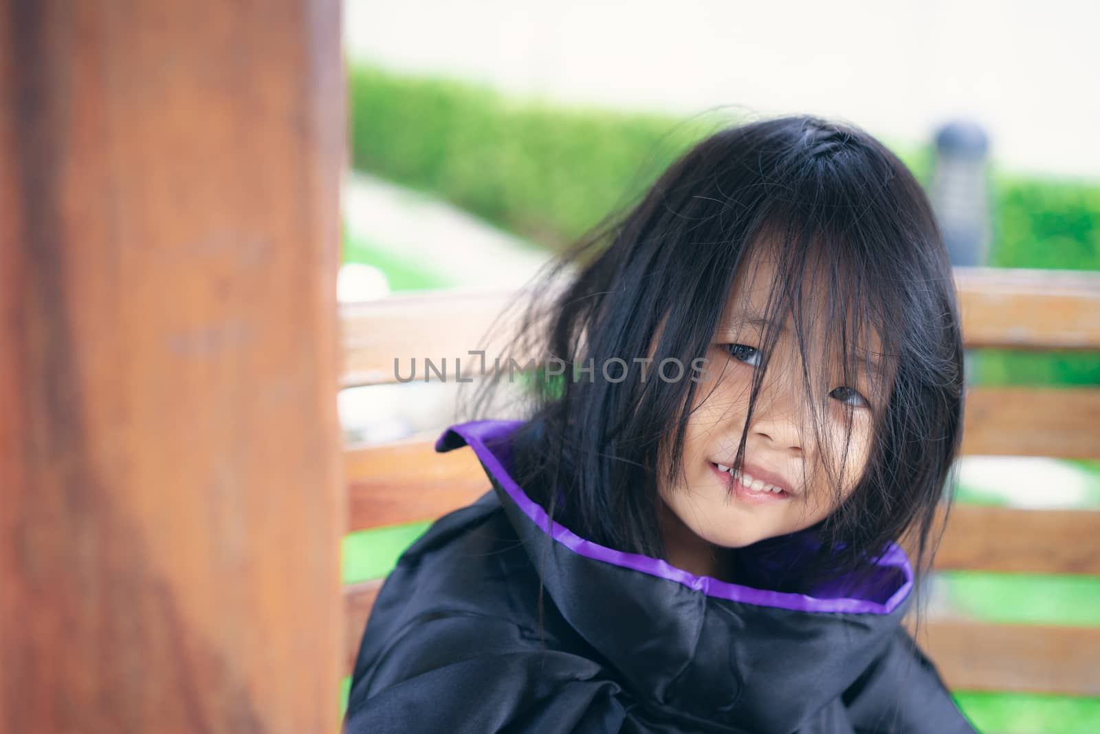 Little girl in a witch costume  in halloween