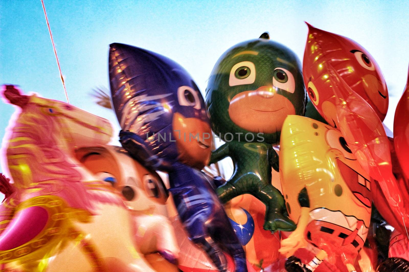 Bunch of colorful balloons in the shape of dolls in Elche