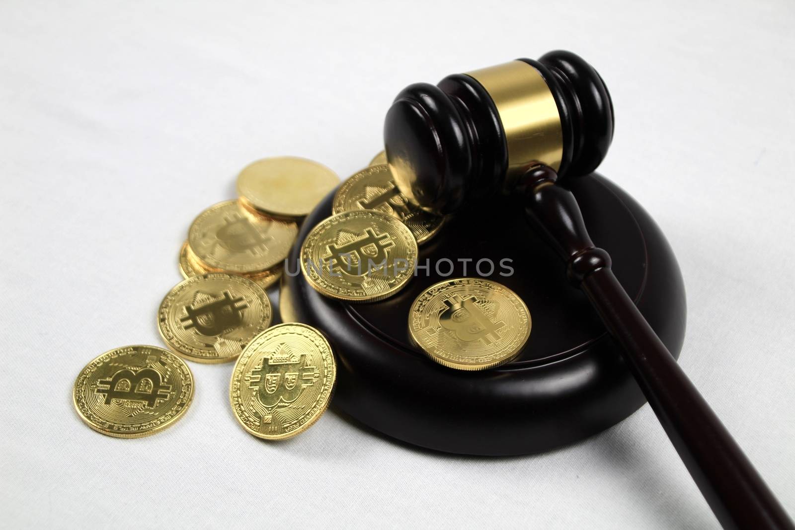 Golden bitcoins and judge gavel by soniabonet