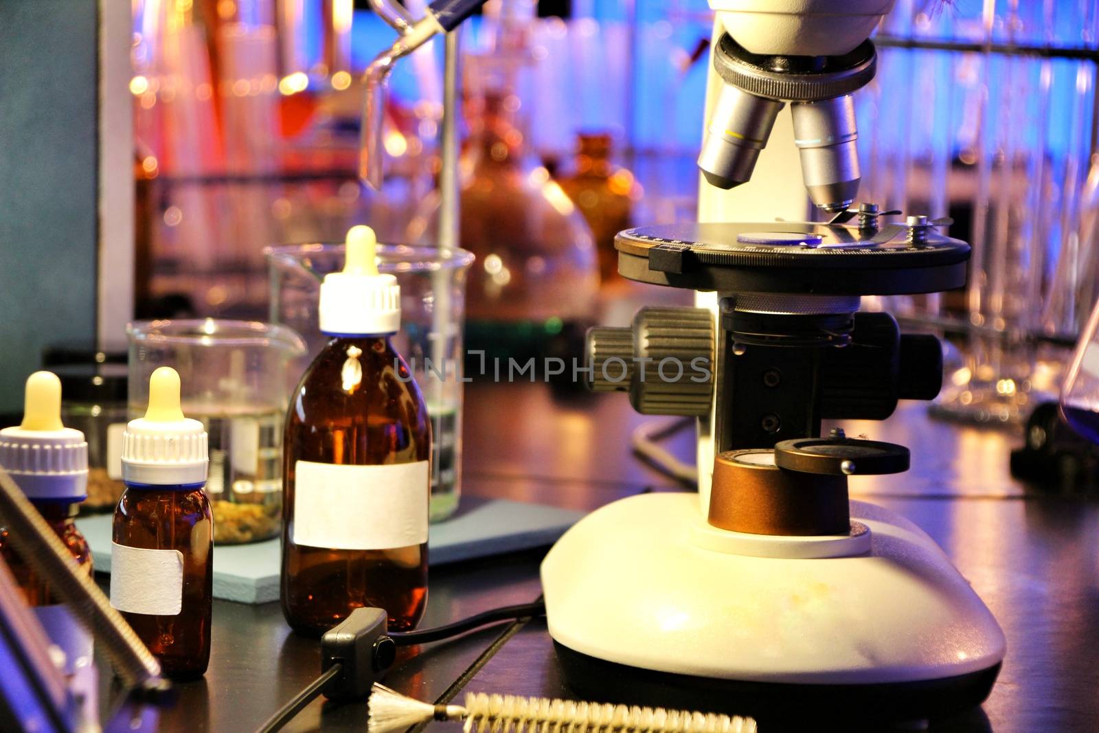 Test tubes, pots and microscope in a laboratory in Spain by soniabonet