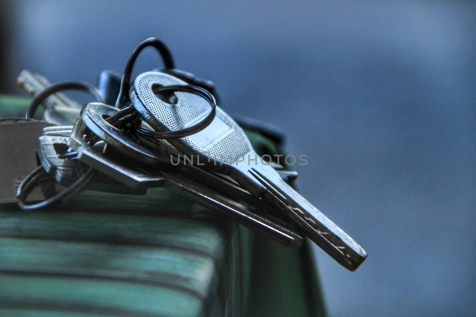 Bunch of keys on the table with green tablecloth