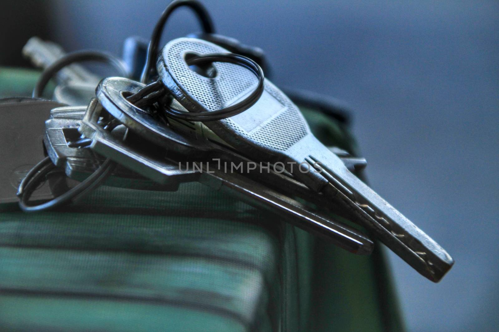 Bunch of keys on the table with green tablecloth