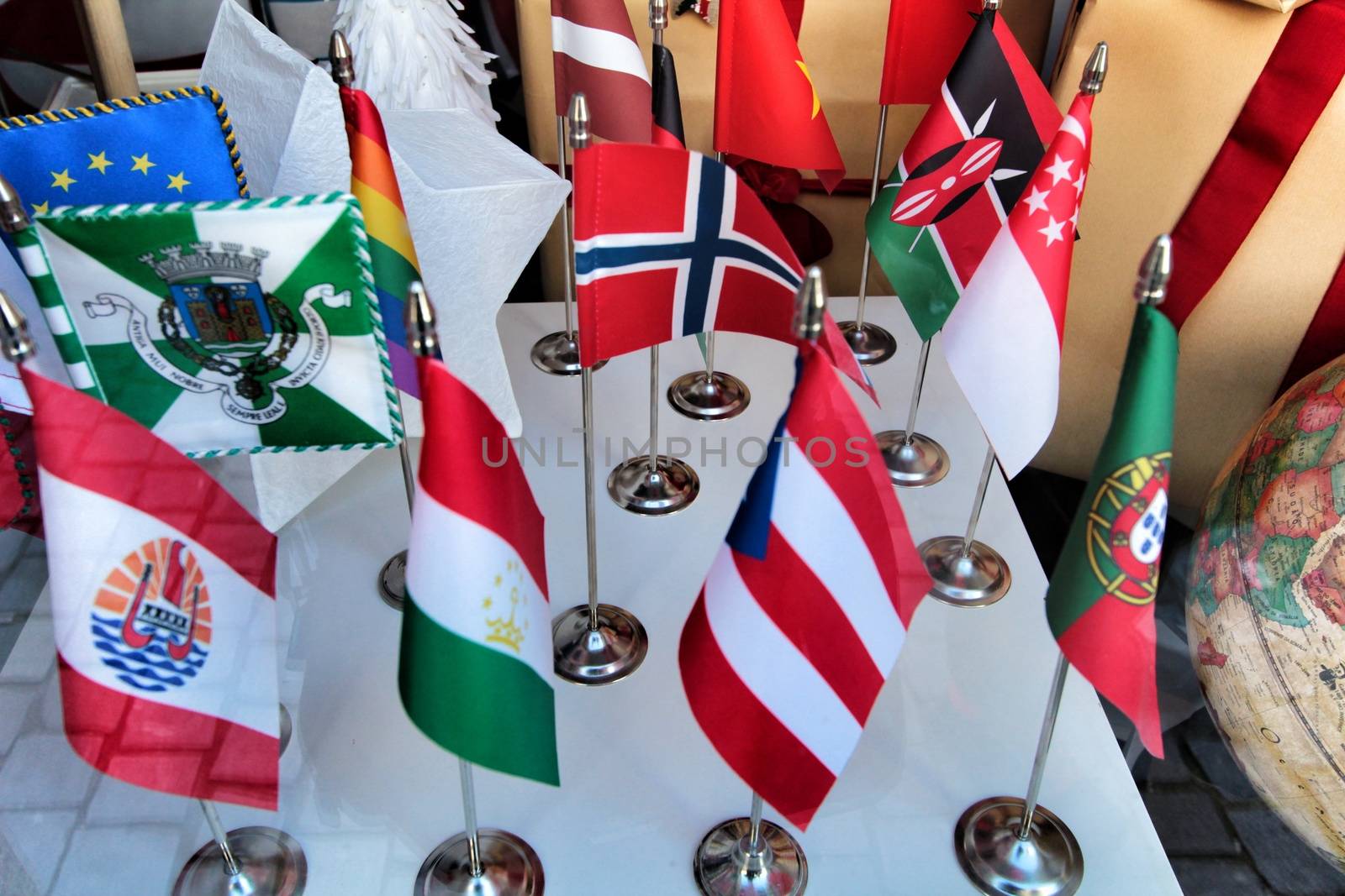 Miniature governmental flags of different countries in a showcase in Portugal