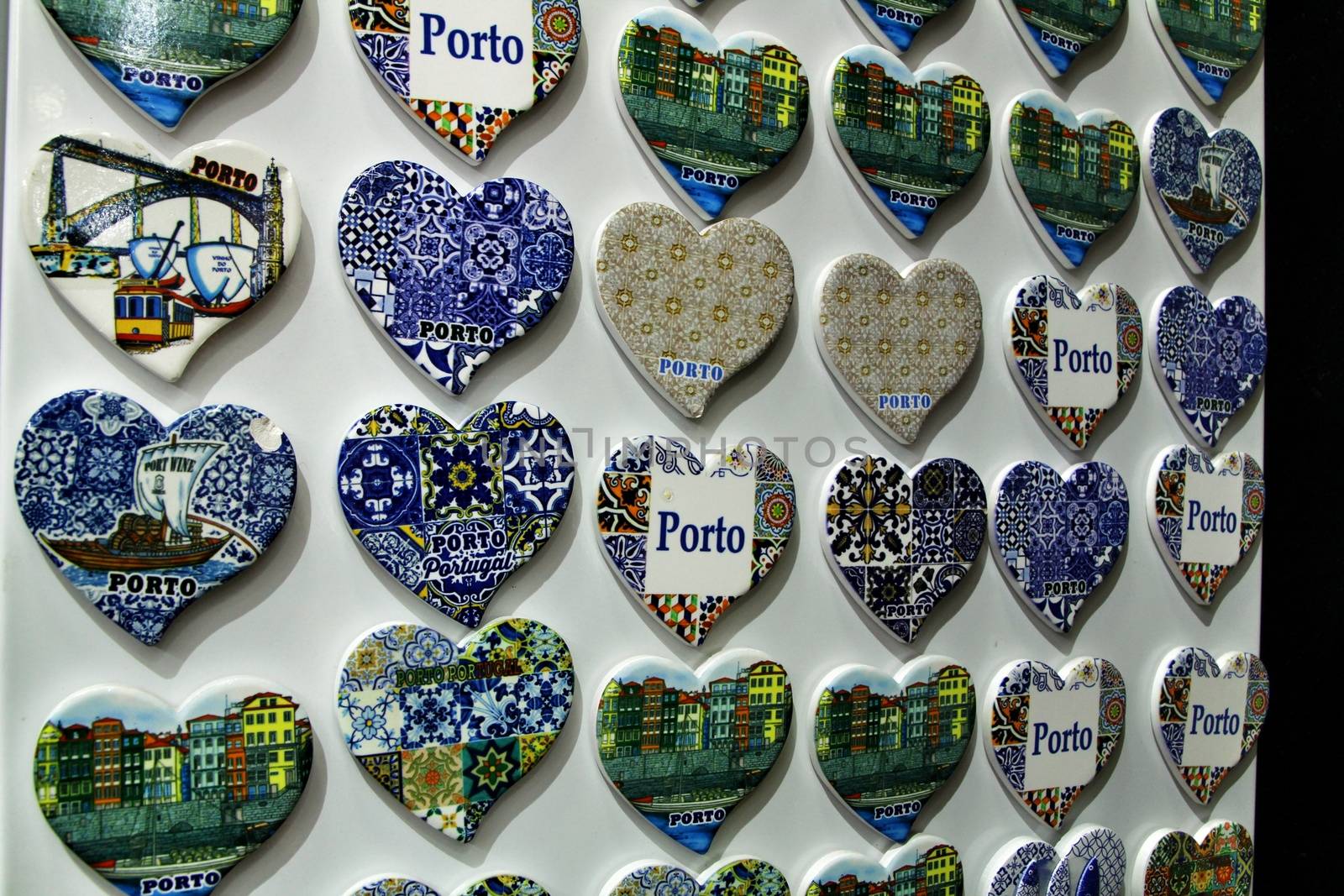 Fridge souvenir magnets imitating portuguese tiles with the word Porto writen on them for sale in Porto
