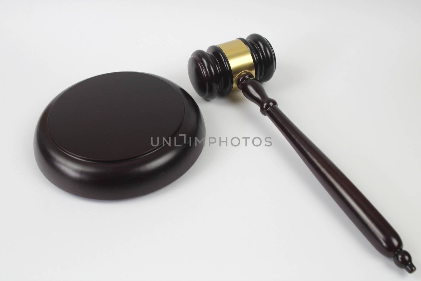 Wooden judge hammer or gavel on white background