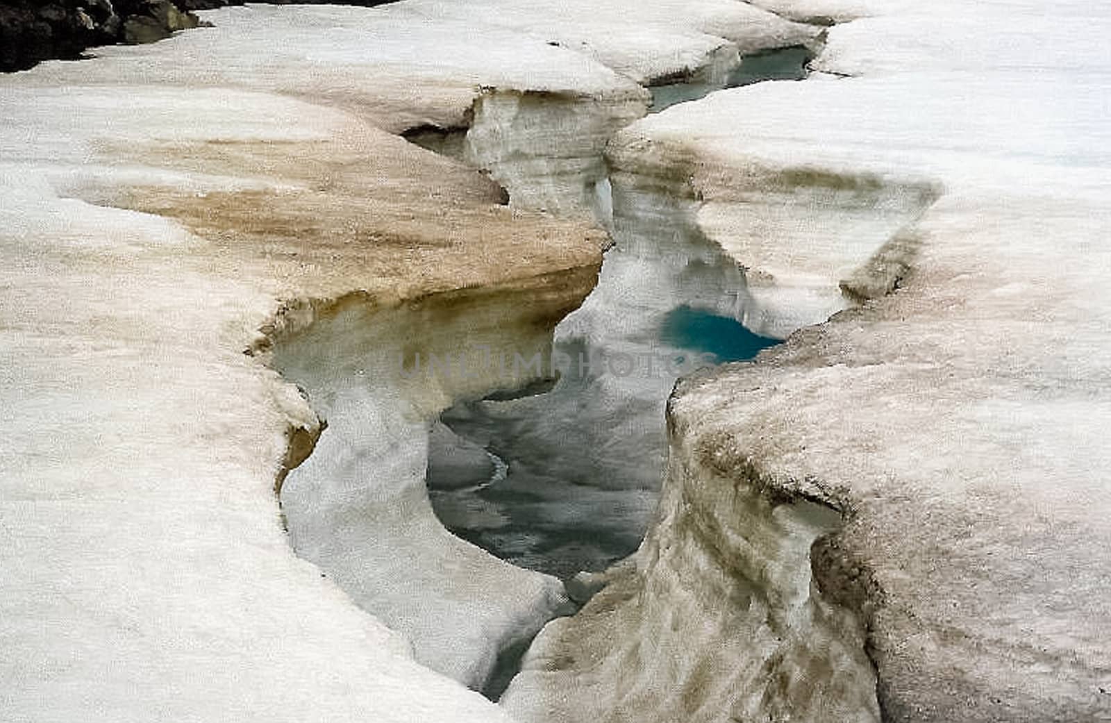 Ice and snow on the river. Melting snow in the spring on the reservoir.