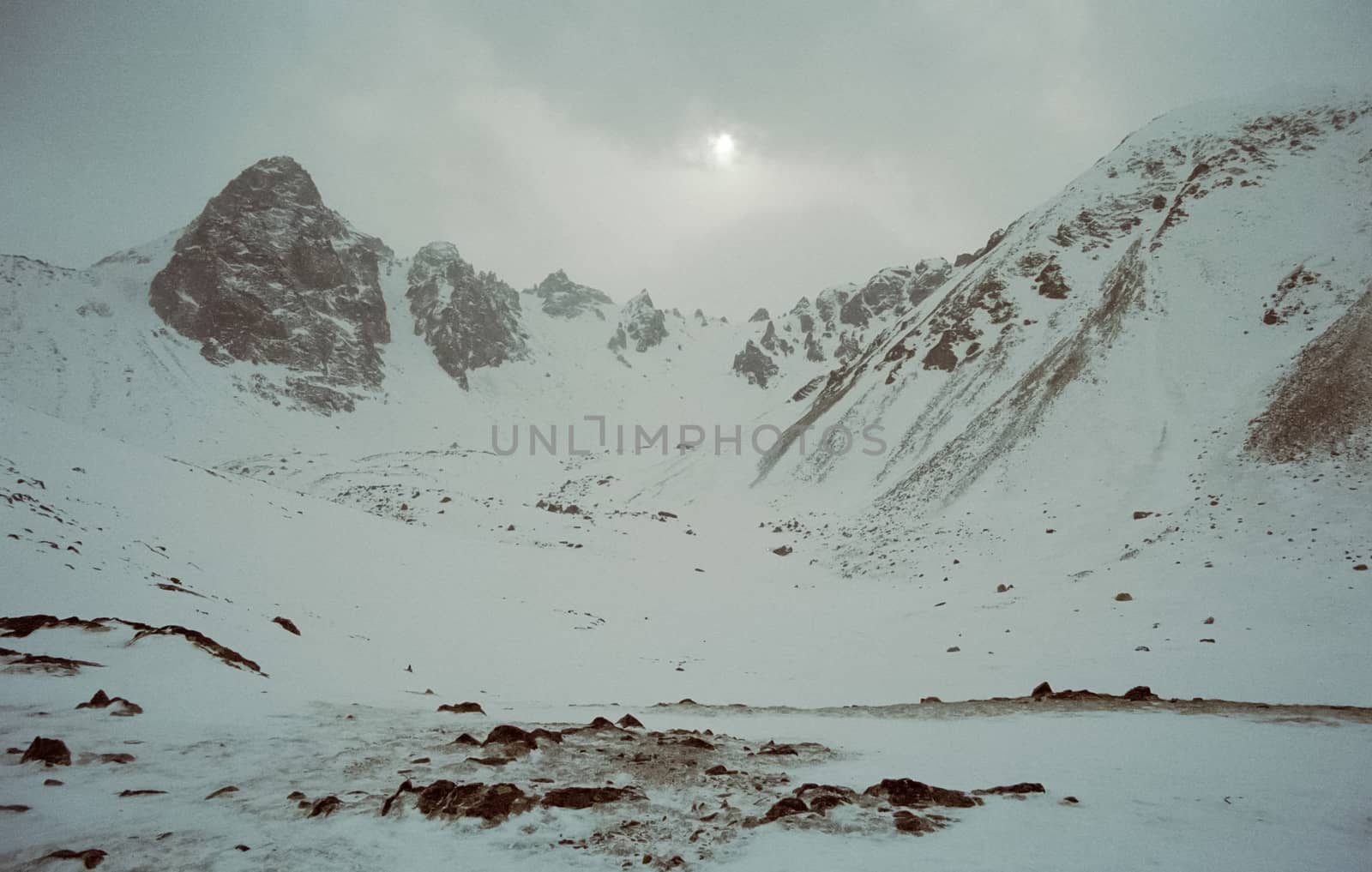 Mount Sayan in winter in the snow. The nature of the mountains is sayan.