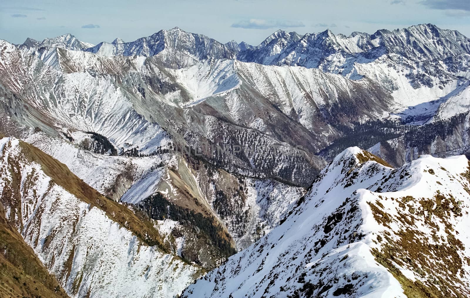 Mount Sayan in winter in the snow. The nature of the mountains is sayan.