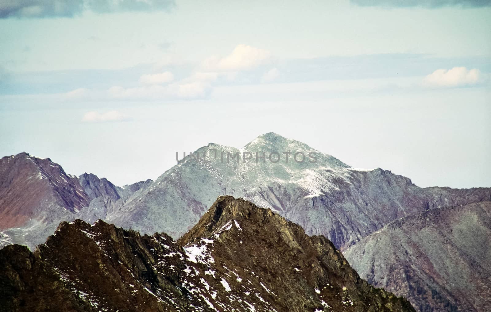 Mount Sayan in winter in the snow. The nature of the mountains is sayan.