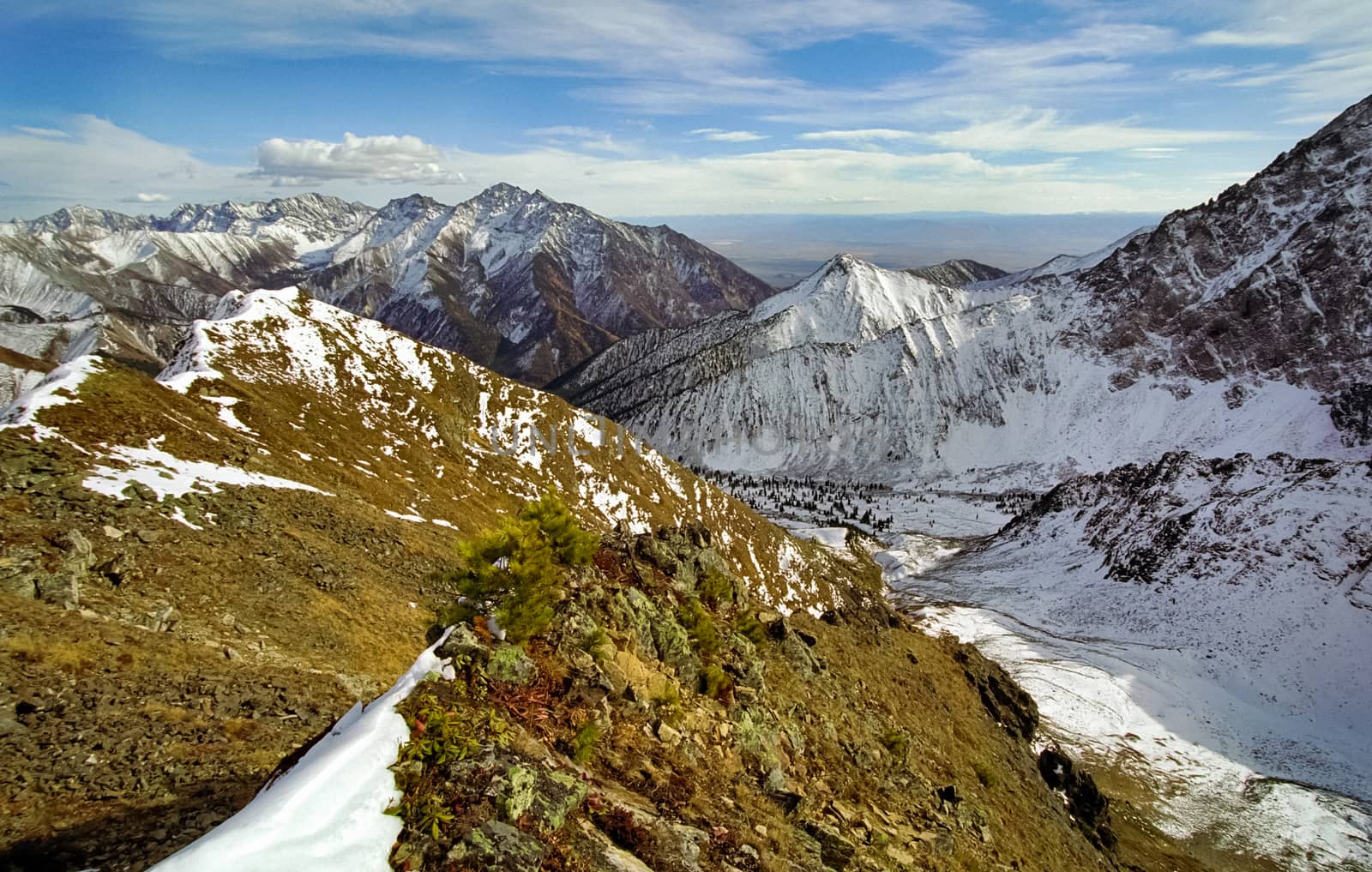 Mount Sayan in winter in the snow. The nature of the mountains is sayan.