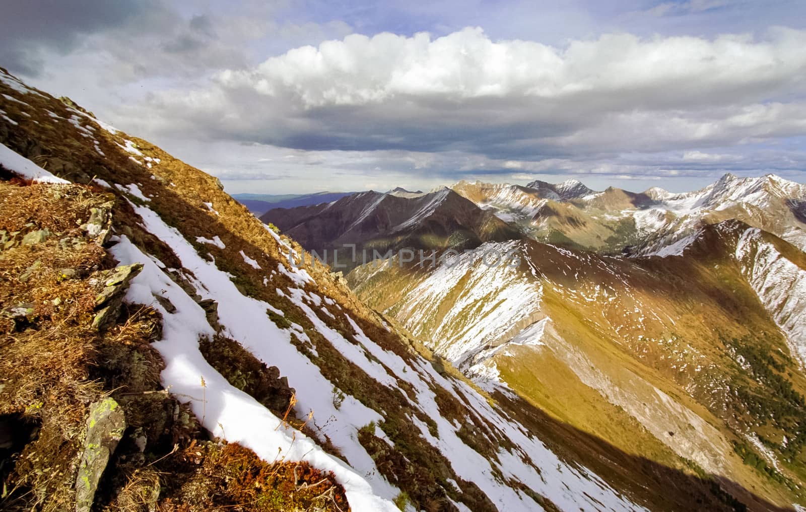 Mount Sayan in winter in the snow. The nature of the mountains is sayan.