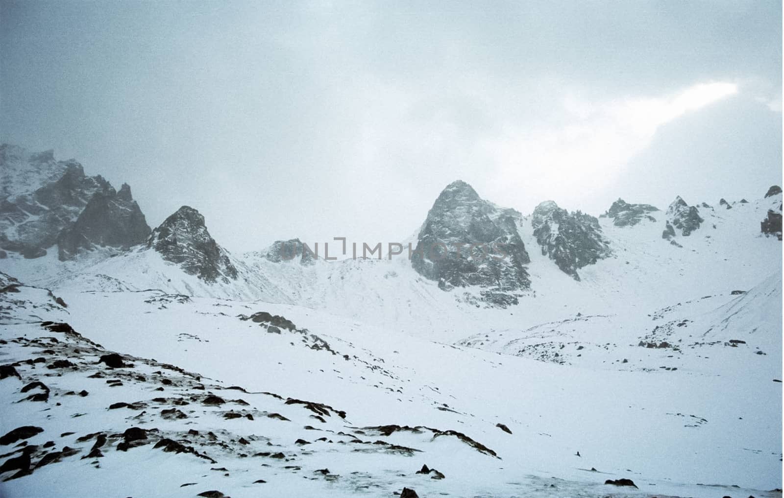 Mount Sayan in winter in the snow. The nature of the mountains is sayan.